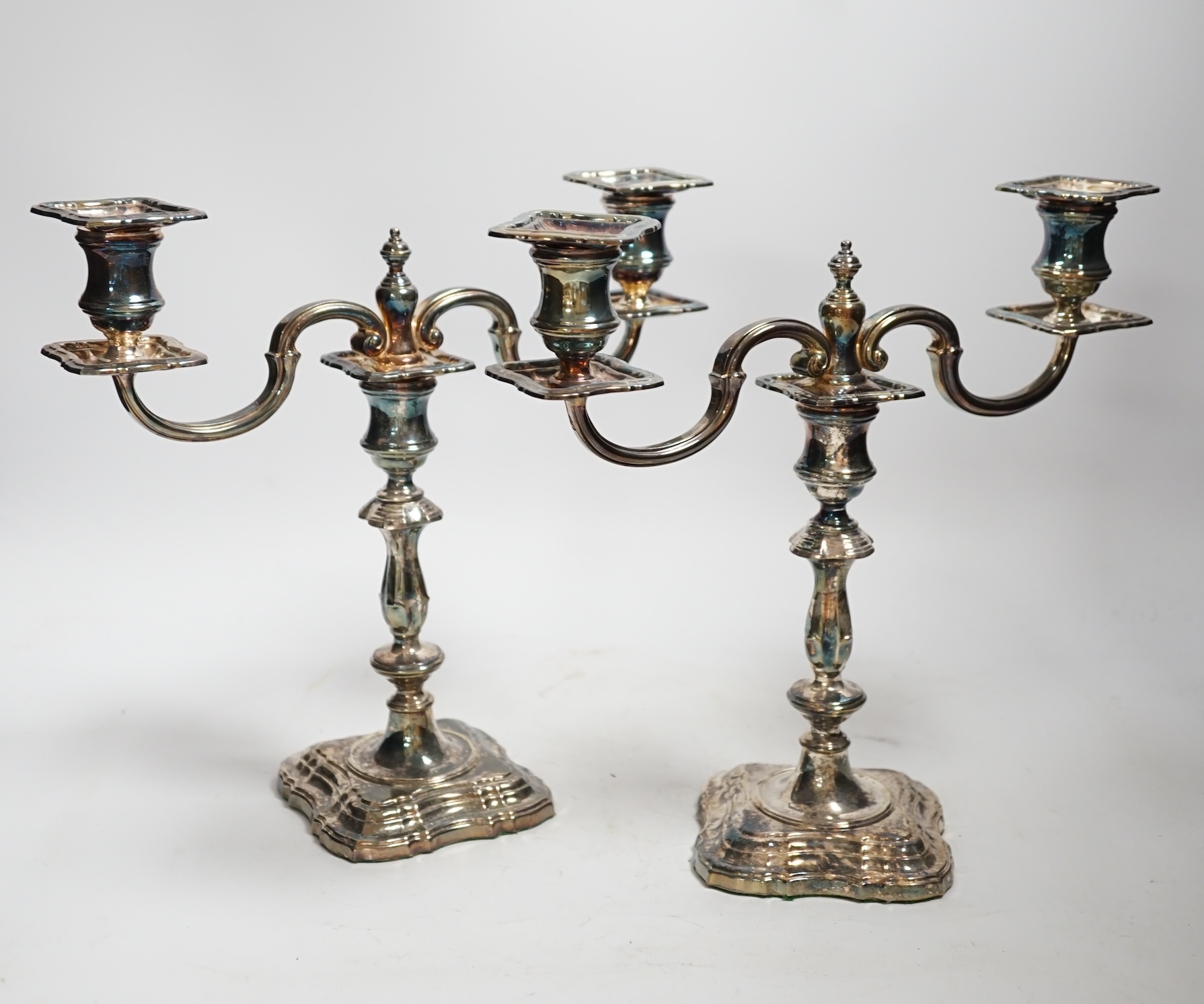 A modern pair of silver two branch, two light candelabra, C.J. Vander Ltd, London, 2000, height 25cm, weighable silver 36oz.